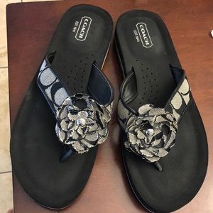Coach black Jillian flip flops.